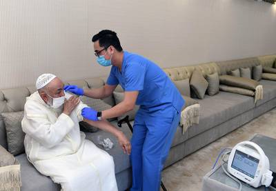 Sheikh Abdullah bin Bayyah, UAE Fatwa Council, is vaccinated with the Sinopharm innoculation on January 4, 2021. Wam