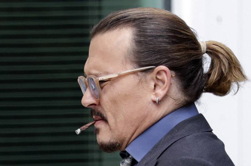 Depp on a smoke break in Fairfax, Virginia.  Getty Images / AFP
