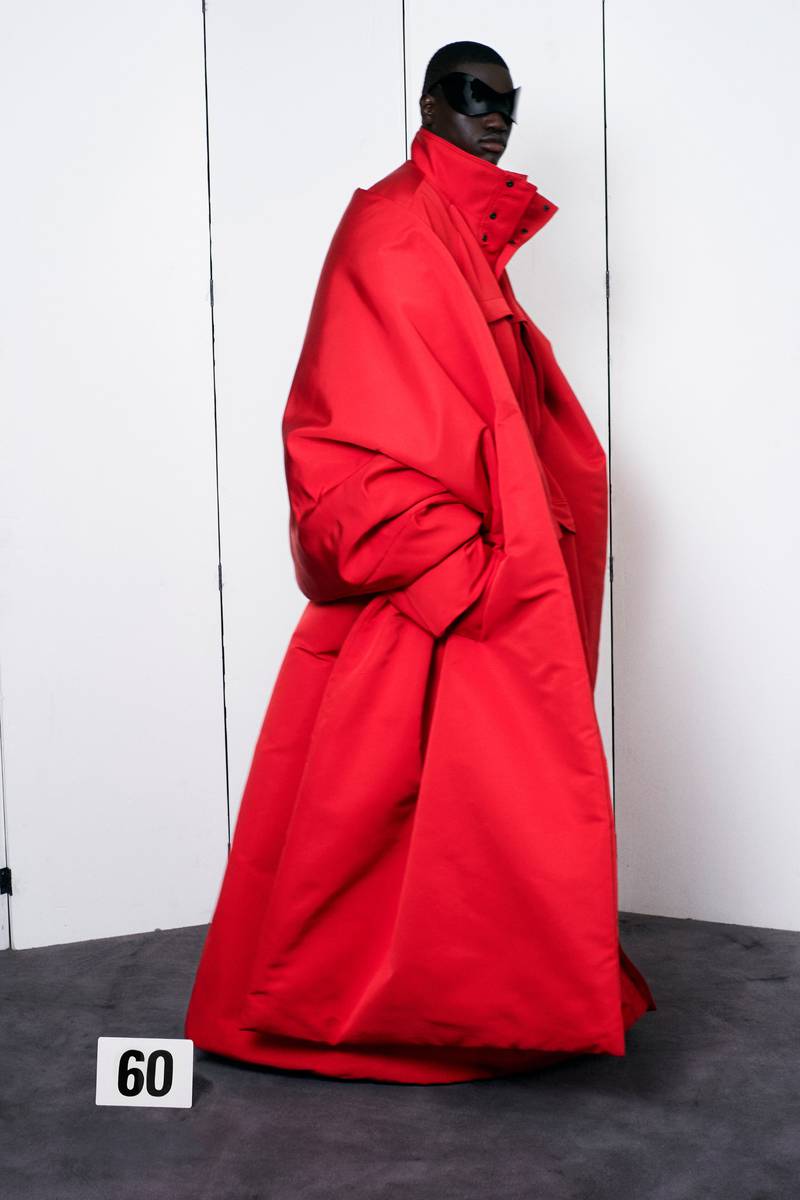 Balenciaga returned to haute couture in Paris this week with men's coats in satin with matching stoles.