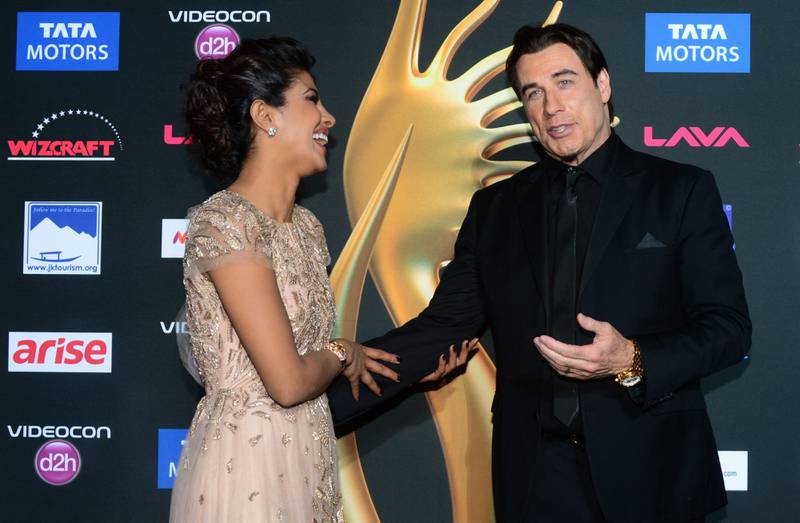 John Travolta and Priyanka Chopra in Florida in 2014. AFP