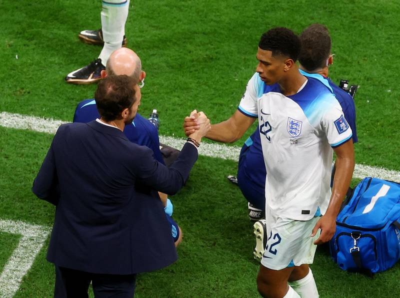 England's Jude Bellingham shakes hands with manager Gareth Southgate after being substituted. Reuters