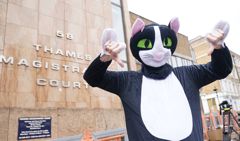 A person dressed as a cat outside Thames Magistrates' Court where West Ham defender Kurt Zouma was being sentenced for kicking his cat after being prosecuted by the RSPCA under the Animal Welfare Act. PA