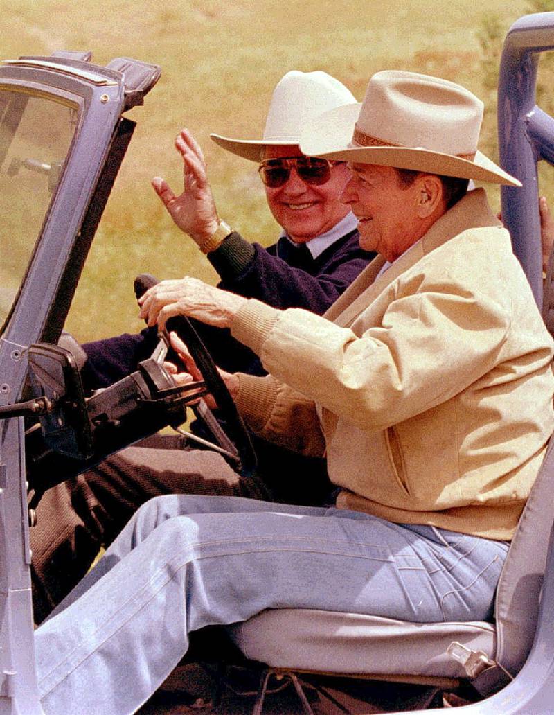 Reagan takes Gorbachev for a drive to tour the ranch. Reuters