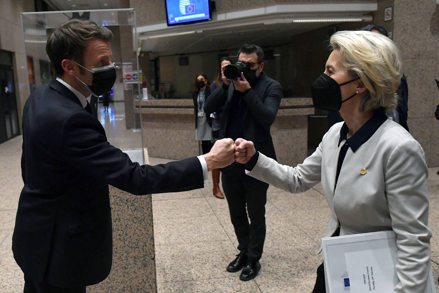French President Emmanuel Macron and European Commission President Ursula von der Leyen bump fists. Photo: Reuters