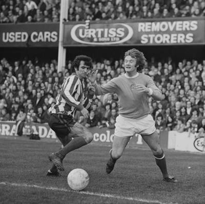 Southampton vs Manchester City match: Scottish soccer player Hugh Fisher of Southampton FC and English soccer player Rodney Marsh of Manchester City FC in action during a match, UK, 25th February 1974.
 (Photo by Daily Express/Hulton Archive/Getty Images)