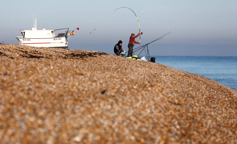 A fisherman casts out in Dungeness, south-east England. Reuters