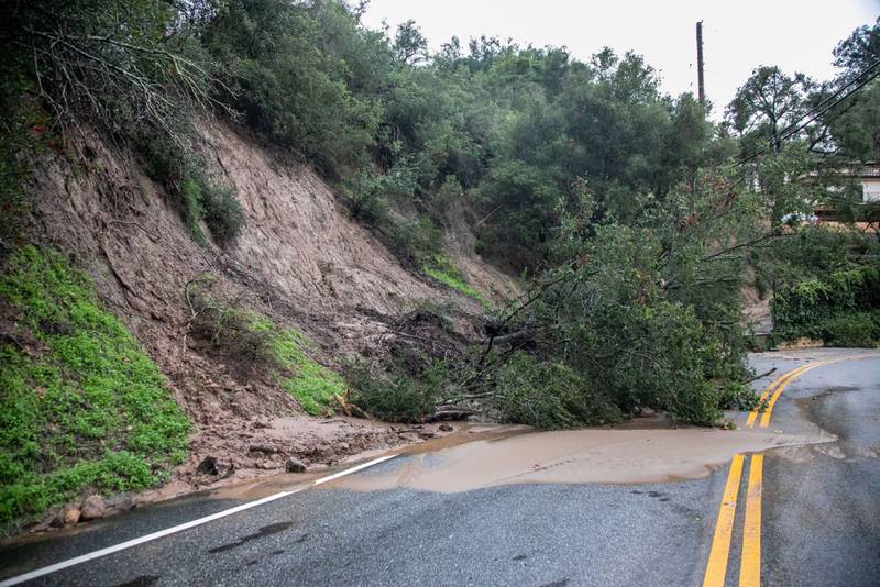 A fallen tree blocks a road after a rainstorm in Montecito. Bloomberg