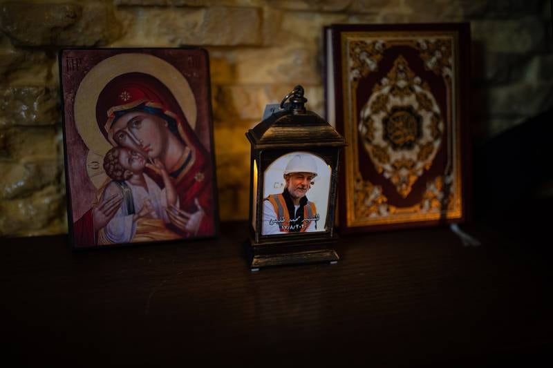 A photograph of Mohammad Tleiss is flanked by an image of the Virgin Mary and a copy of the Quran in Kayan Tleiss’s living room in Khalde in Beirut.