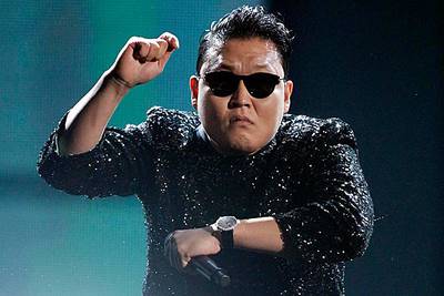 South Korean rapper Psy performs "Gangnam Style" at the 40th American Music Awards in Los Angeles, California, in this November 18, 2012 file photo.   Psy's music video "Gangnam Style" became the most watched item on YouTube on November 24, 2012,  with over 800 million views. REUTERS/Danny Moloshok/Files (UNITED STATES - Tags: ENTERTAINMENT SOCIETY)
