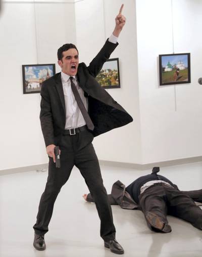 Police officer Mevlut Mert Altintas, shouts after shooting Andrei Karlov, the Russian ambassador to Turkey, in Ankara in 2016. Altintas was killed by police shortly afterwards. AP