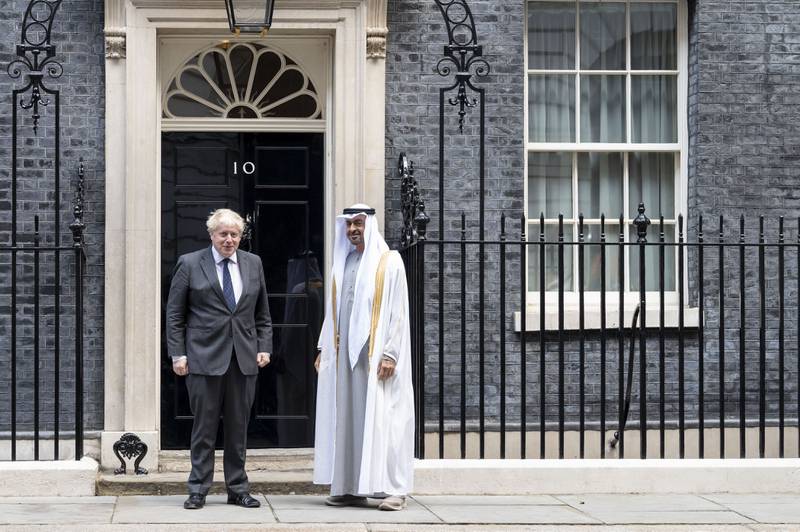 Sheikh Mohamed bin Zayed, Crown Prince of Abu Dhabi and Deputy Supreme Commander of the Armed Forces, stands for a photograph with Mr Johnson at 10 Downing Street, on September 16. Hamad Al Kaabi / Ministry of Presidential Affairs