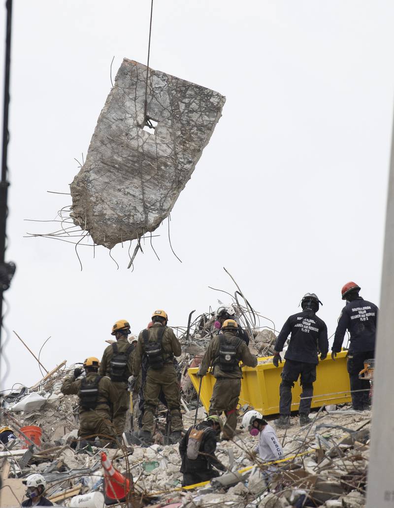 A piece of concrete is removed to help search and rescue teams look for survivors and recover the bodies of other residents. Getty