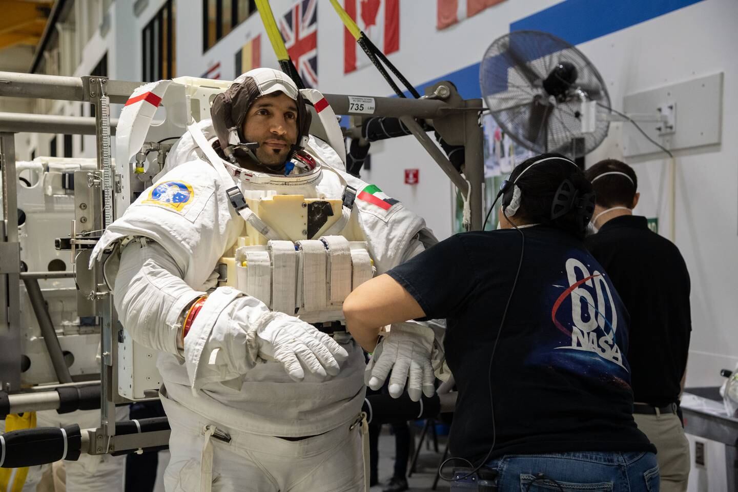 PHOTO DATE:  01-19-21LOCATION:  NBL - Pool TopsideSUBJECT:  Photographic coverage of UAE astronauts Hazzaa AlMansoori and Sultan AlNeyadi in Topside Suit-up for EVQ NBL 1 training in NBL/pool deckPHOTOGRAPHER: BILL STAFFORD