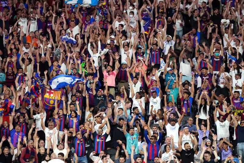 Fans cheer on Barcelona and Real Madrid during the pre-season game at Allegiant Stadium. EPA