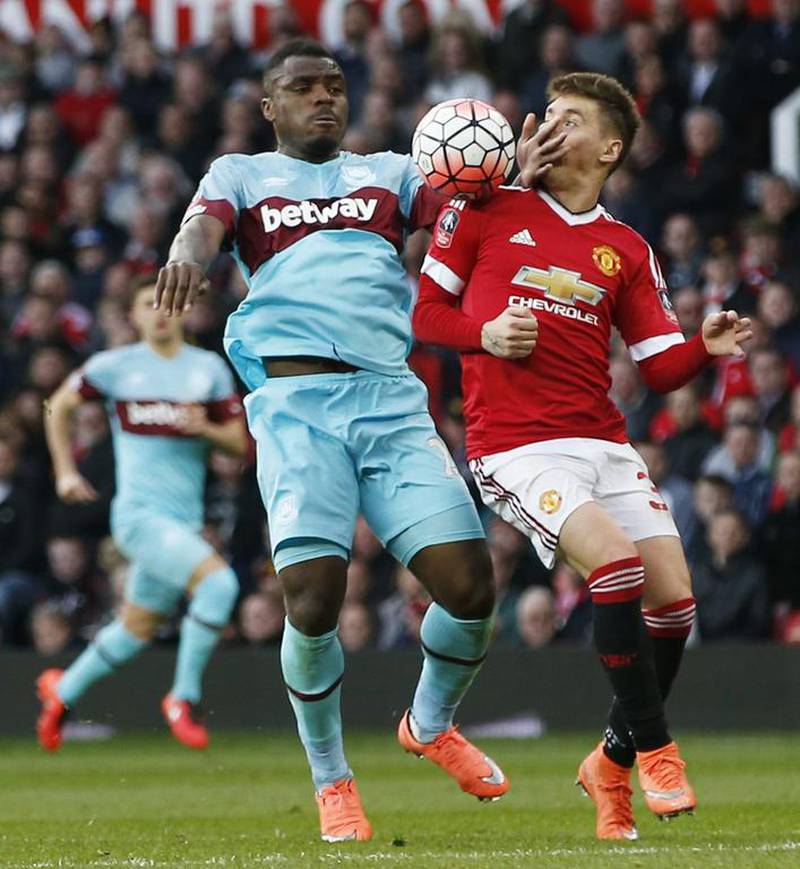 Manchester United’s Guillermo Varela in action with West Ham’s Emmanuel Emenike. Reuters / Andrew Yates