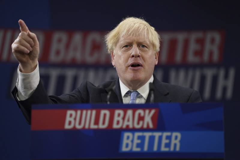 Britain's Prime Minister Boris Johnson making a speech at the Conservative Party conference in October 2021. Since then, he has faced a series of crises, including the Partygate scandal, but still appears to appeal to some voters. AP