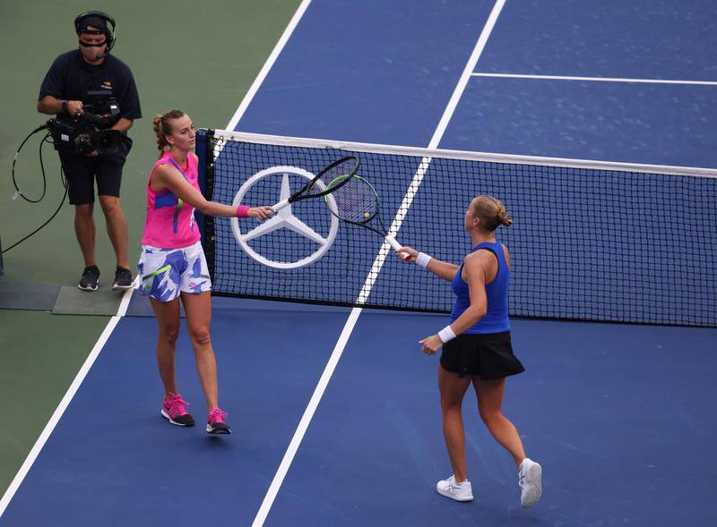 Shelby Rogers taps rackets with Petra Kvitova after winning their fourth-round match at the US Open. AFP
