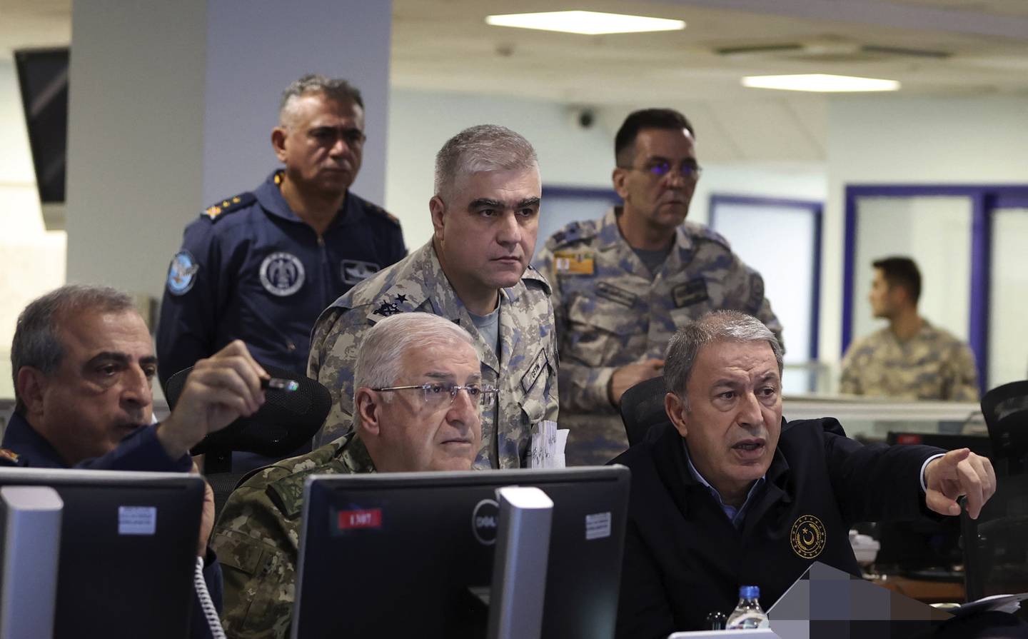 Turkish Defence Minister Hulusi Akar, right, and top army commanders at the Air Force command centre, in Ankara, Turkey, on Sunday. AP