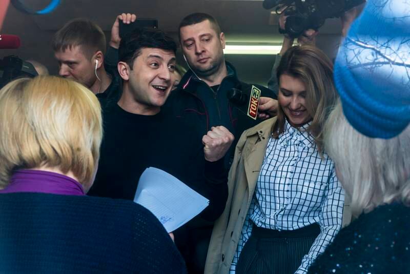 Mr Zelenskyy holds his ballot at a polling station before voting in Ukraine's presidential election in March 2019 in Kyiv. Getty Images
