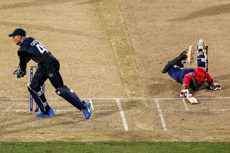 UAE captain CP Rizwan dives to make his ground against Namibia. He finished unbeaten on 43. AFP