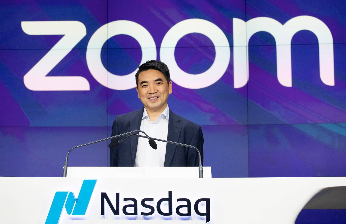 FILE - In this April 18, 2019 file photo, Zoom CEO Eric Yuan attends the opening bell at Nasdaq as his company holds its IPO in New York.  Millions of people are now working from home as part of the intensifying fight against the coronavirus outbreak. Beside relying on Zoom, the video conference service, more frequently as part of their jobs, more people are also tapping it to hold virtual happy hours with friends and family banned from gathering in public places.  (AP Photo/Mark Lennihan, File)