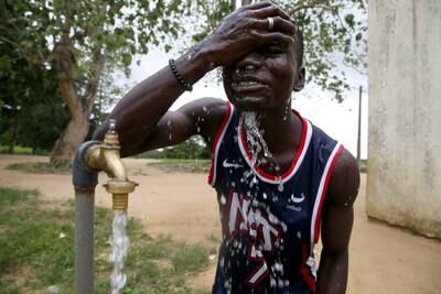 A man in Abidjan, Ivory Coast, a day before World Water Day. Ivorian Prime Minister Patrick Achi announced an investment of about $5 billion to achieve universal access to drinking water by 2030. EPA