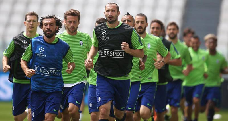 Juventus players Andrea Pirlo and Giorgio Chiellini lead a team jog during their training session on Monday for the Champions League final. Marco Bertorello / AFP
