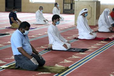 Midday prayers were performed at Al Farooq Omar Bin Al Khattab Mosque in Dubai on Wednesday. Worshippers kept a distance of at least three metres between each other. Chris Whiteoak / The National