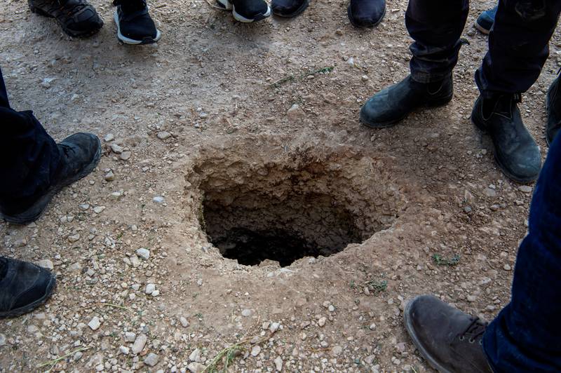 The narrow escape tunnel started beneath a sink and continued deep underground. Reuters