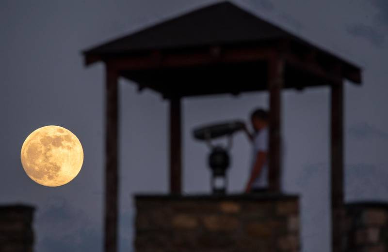 A stargazer takes in the celestial event from a castle in Skopje, North Macedonia. EPA