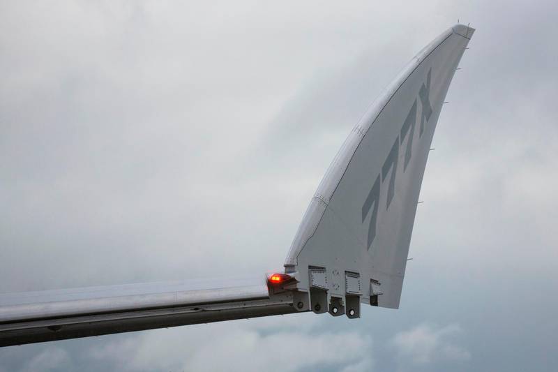 A folding wingtip is pictured on a Boeing 777X airplane taxis for the first flight, which had to be rescheduled due to weather, at Paine Field in Everett, Washington on January 24, 2020. AFP