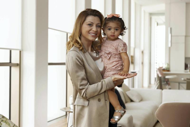 DUBAI, UNITED ARAB EMIRATES. 02 OCTOBER 2019. Money & Me Q&A on spending habits and the philosophy on money with Andreea Danila, founder of Millennial Capital, the region’s first specialist consumer-focused venture creation and management firm. Pictured with her 15 month old daughter in their Business Bay apartment. (Photo: Antonie Robertson/The National) Journalist: Nada El Sawy. Section: Business.
