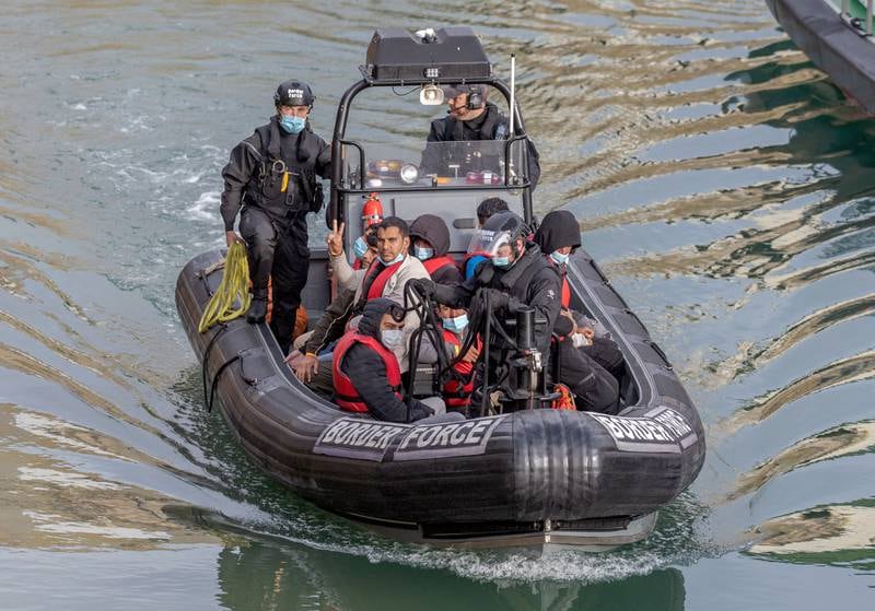 Border Force officials escorted people on boats crossing the English Channel from France to Dover, England, on June 29. EPA
