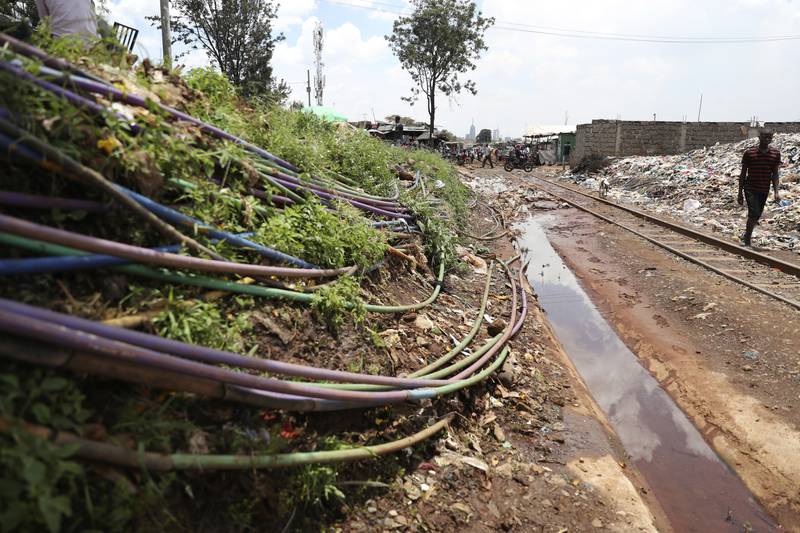 A web of plastic pipes connects water to some of the houses at the Kibera slum in Nairobi, Kenya. AP