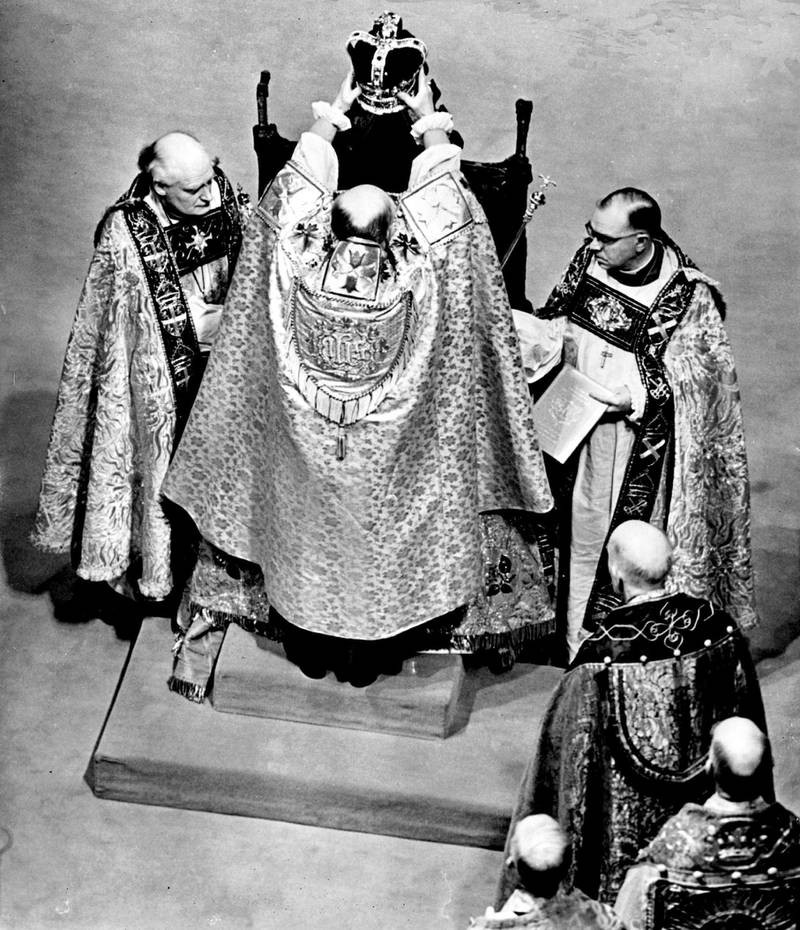 Queen Elizabeth sitting on the St Edward's Chair, as she is crowned by the Archbishop of Canterbury.