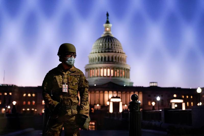 Members of the National Guard gather at the US Capitol as the House of Representatives prepares to begin the voting process on a resolution demanding US Vice President Pence and the cabinet remove President Trump from office, in Washington, US, January 12, 2021. Reuters