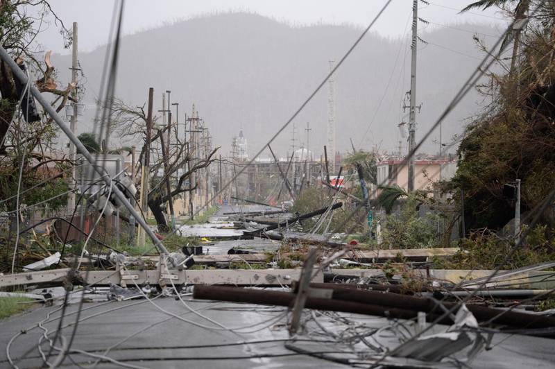 Electricity poles and lines lay toppled on the road after Hurricane Maria hit the eastern region of the island, in Humacao, Puerto Rico. Carlos Giusti / AP Photo