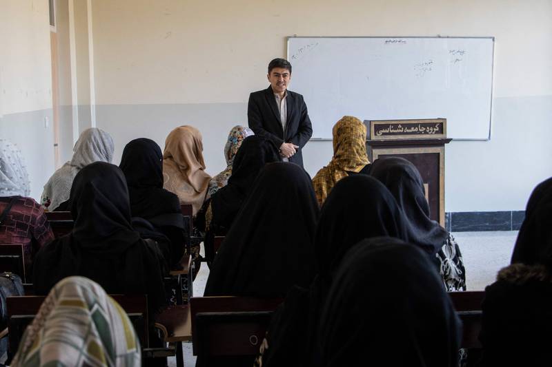 Women attend a class in Badakshan University as Afghanistan's universities reopen for the first time since the Taliban seized power. AFP