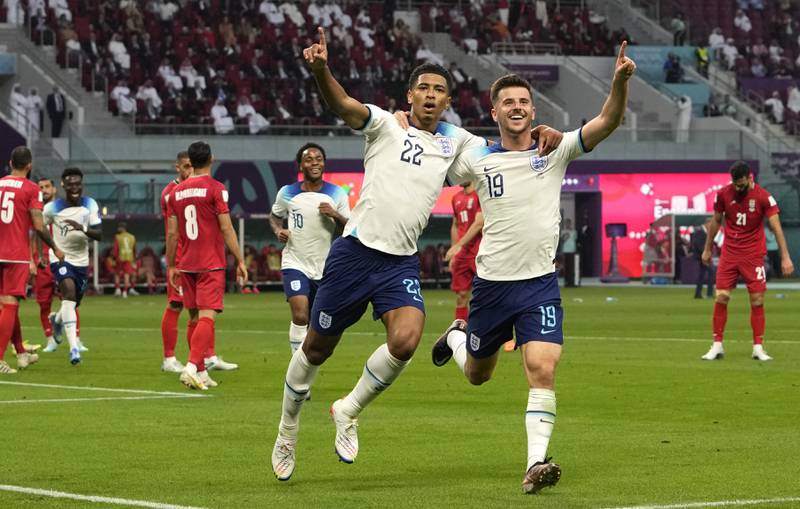 Jude Bellingham celebrates with Mason Mount after scoring England's opening goal in the 6-2 victory against Iran at the Khalifa International Stadium in Doha on November 21, 2022. AP