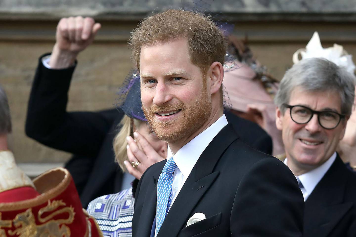 CORRECTION / Britain's Prince Harry, Duke of Sussex reacts as he leaves St George's Chapel in Windsor Castle, Windsor, west of London, on May 18, 2019, after the wedding of Lady Gabriella Windsor and Thomas Kingston. Lady Gabriella, is the daughter of Prince and Princess Michael of Kent. Prince Michael, is the Queen Elizabeth II's cousin.
 / AFP / POOL / Steve Parsons
