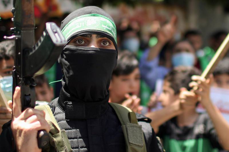 A Palestinian Hamas militant takes part in a protest in the northern Gaza Strip over the possible eviction of several Palestinian families from homes in the Jerusalem's Sheikh Jarrah neighbourhood. Reuters