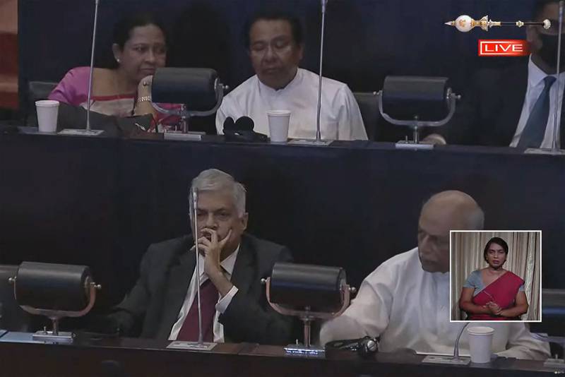 A screen grab of Mr Wickremesinghe, bottom left, during the vote count announcement in Sri Lanka's Parliament. AFP