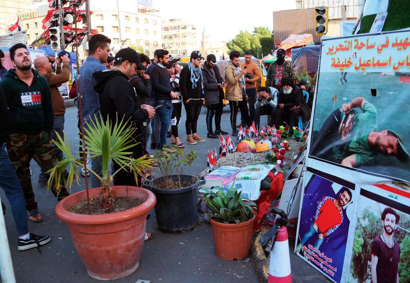 Posters of anti-government protesters who have been killed in demonstrations are displayed in Tahrir Square during ongoing protests in Baghdad, Iraq. AP Photo