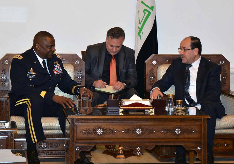A handout picture made available by the Iraqi Prime Minister's office shows Iraqi Prime Minister Nuri al-Maliki (R) meeting US Vice Chief of the Army, General Lloyd J. Austin III (L) in Baghdad on May 14, 2013. AFP PHOTO/IRAQI PRIME MINISTER OFFICE/HO ==RESTRICTED TO EDITORIAL USE - MANDATORY CREDIT "AFP PHOTO / HO / IRAQI PRIME MINISTER OFFICE" - NO MARKETING NO ADVERTISING CAMPAIGNS - DISTRIBUTED AS A SERVICE TO CLIENTS == (Photo by - / IRAQI PRIME MINISTER'S OFFICE / AFP)