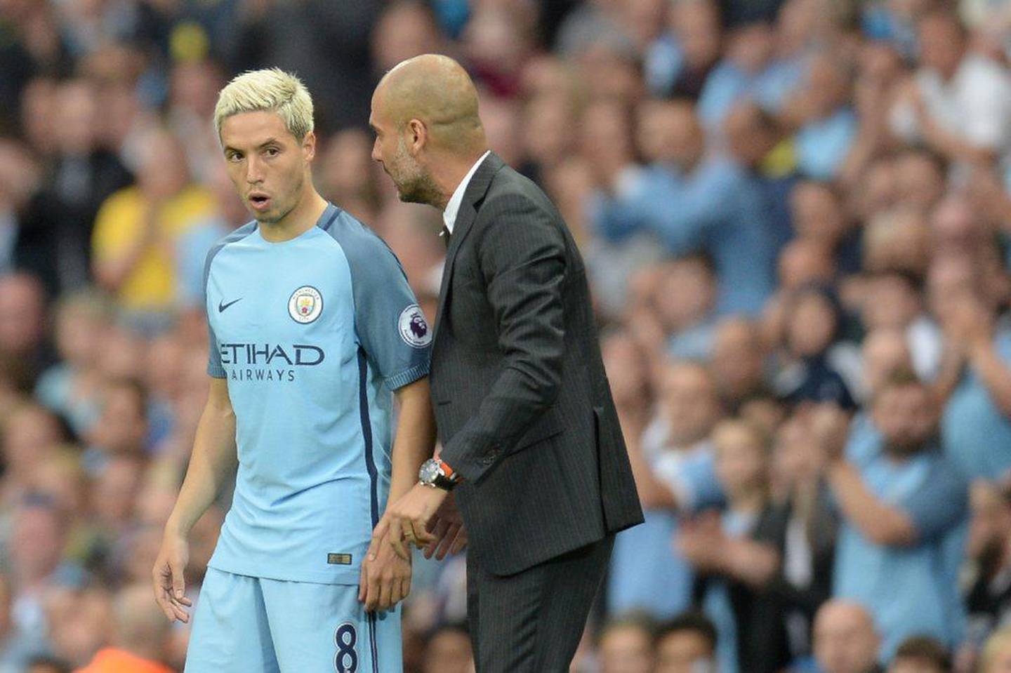 Pep Guardiola, right, would bear witness to Samir Nasri's difficult nature. Oli Scarff / AFP