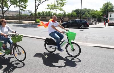A Real Madrid fan cycles through Paris prior to the Champions League final. Getty