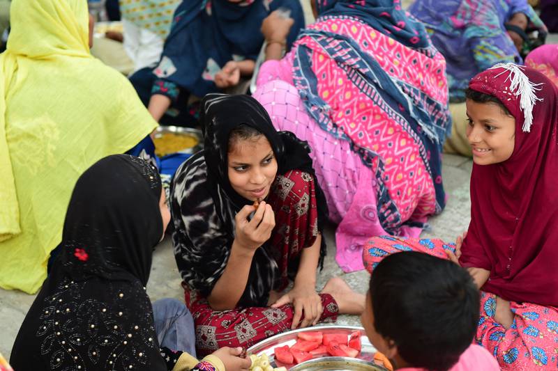 Muslims break their fast at the Shah-E-Alam shrine in Ahmedabad, India. AFP