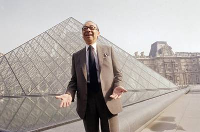 Pei laughs while posing for a portrait in front of the Louvre glass pyramid in 1989. AP Photo