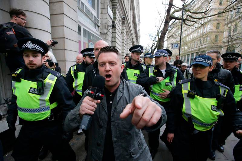 (FILES) In this file photo taken on April 01, 2017 Stephen Christopher Yaxley-Lennon, AKA Tommy Robinson, former leader of the right-wing EDL (English Defence League) is escorted away by police from a Britain First march and an English Defence League march in central London on April 4, 2017 following the deadly terror attack against the British Parliament on March 22.
British alt-right activist Tommy Robinson was freed from prison on August1, 2018 after winning a legal challenge in a case that has stirred his supporters worldwide. / AFP PHOTO / Daniel LEAL-OLIVAS