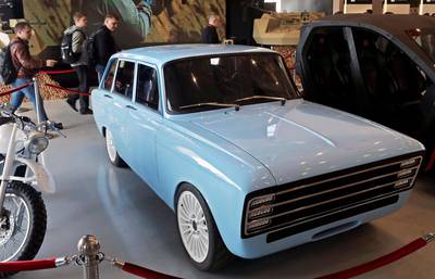 epaselect epa06969087 A blue prototype of CV-1 electric car manufactured by Concern Kalashnikov, Russian producer of a wide range of precision weapons, is exhibited during ARMY 2018 International Military and Technical Forum in the Patriot Park in Alabino, Moscow region, Russia, 24 August 2018.  The car has driving range of 350 km between battery pack recharges and it accelerates from 0 to 100 km/h in 6 seconds. The presented retro-looking concept which is constructed on the basis of a Soviet-era hatchback IZh-21252 Kombi is used  as a stand for testing of developed complex systems.  EPA/SERGEI ILNITSKY